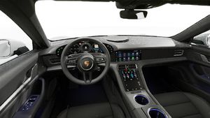 Interior view showing the steering wheel and dashboard of Taycan 4S