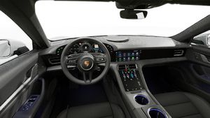 Interior view showing the steering wheel and dashboard of Taycan 4S