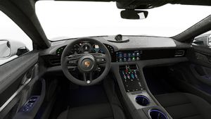 Interior view showing the steering wheel and dashboard of Taycan GTS
