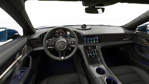 Interior view showing the steering wheel and dashboard of Taycan Turbo S