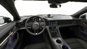 Interior view showing the steering wheel and dashboard of Taycan Turbo S