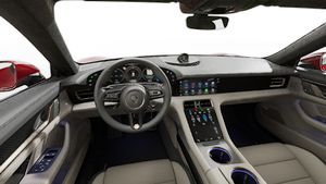 Interior view showing the steering wheel and dashboard of Taycan Turbo S