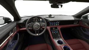 Interior view showing the steering wheel and dashboard of Taycan Turbo S