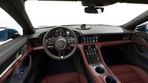 Interior view showing the steering wheel and dashboard of Taycan Turbo S