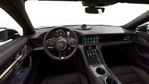 Interior view showing the steering wheel and dashboard of Taycan Turbo S