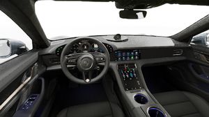 Interior view showing the steering wheel and dashboard of Taycan Turbo S