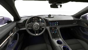Interior view showing the steering wheel and dashboard of Taycan Turbo S
