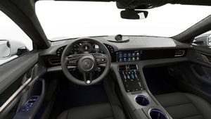 Interior view showing the steering wheel and dashboard of Taycan Turbo S