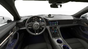 Interior view showing the steering wheel and dashboard of Taycan Turbo S