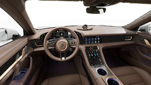 Interior view showing the steering wheel and dashboard of Taycan Turbo S