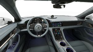 Interior view showing the steering wheel and dashboard of Taycan Turbo S