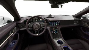 Interior view showing the steering wheel and dashboard of Taycan Turbo S