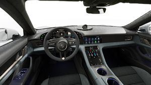 Interior view showing the steering wheel and dashboard of Taycan Turbo S