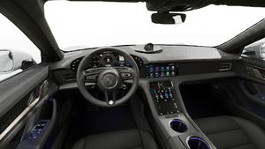 Interior view showing the steering wheel and dashboard of Taycan Turbo S