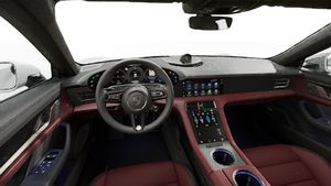 Interior view showing the steering wheel and dashboard of Taycan Turbo S