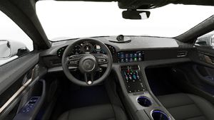 Interior view showing the steering wheel and dashboard of Taycan Turbo S