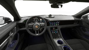 Interior view showing the steering wheel and dashboard of Taycan Turbo GT