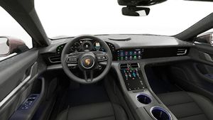 Interior view showing the steering wheel and dashboard of Taycan 4 Cross Turismo