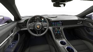 Interior view showing the steering wheel and dashboard of Taycan 4 Cross Turismo