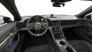 Interior view showing the steering wheel and dashboard of Taycan Turbo Cross Turismo
