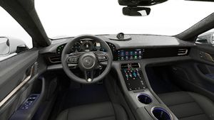 Interior view showing the steering wheel and dashboard of Taycan Turbo Cross Turismo