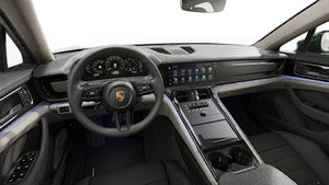 Interior view showing the steering wheel and dashboard of Panamera 4