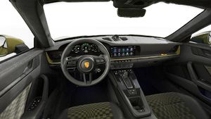 Interior view showing the steering wheel and dashboard of 911 Spirit 70